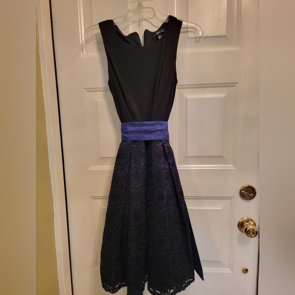 Gorgeous Navy & Black lace dress. New without tags. Size 4. R & K brand